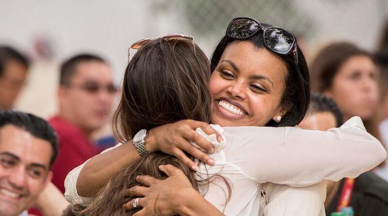 two women embrace