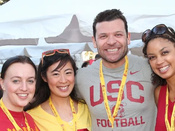 a group of young alumni attending an outdoor event