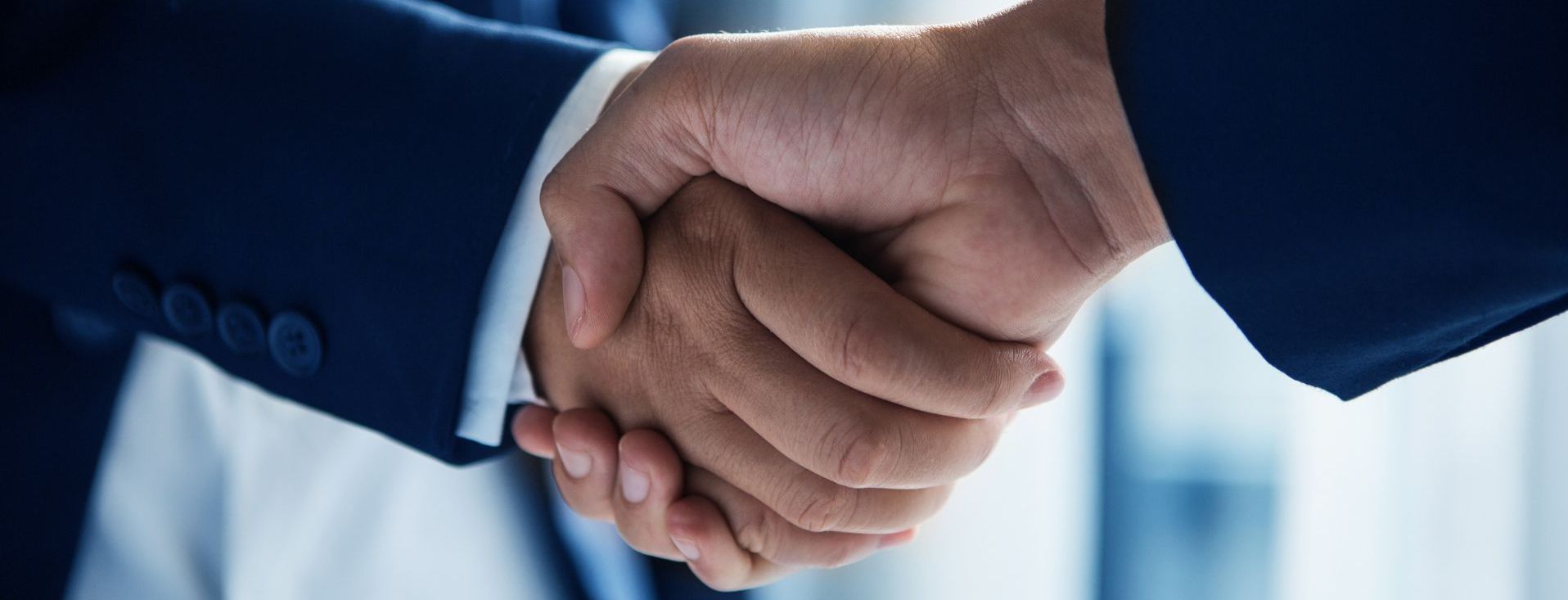close-up of a handshake between two businesspeople