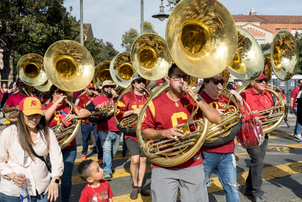 sousaphone players perform with Trojan Marching Band