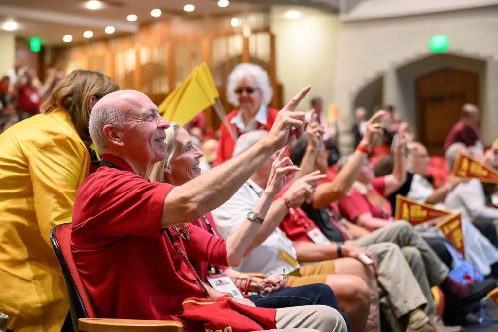 USC alumni sit in an auditorium