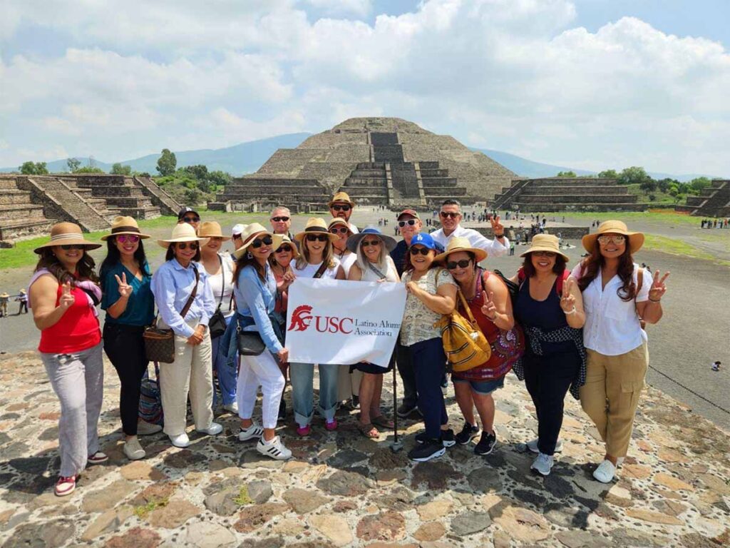 group stands in front of ziggurat