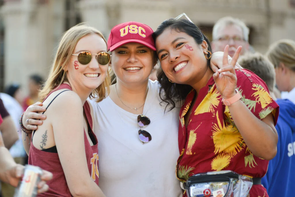 three women embrace