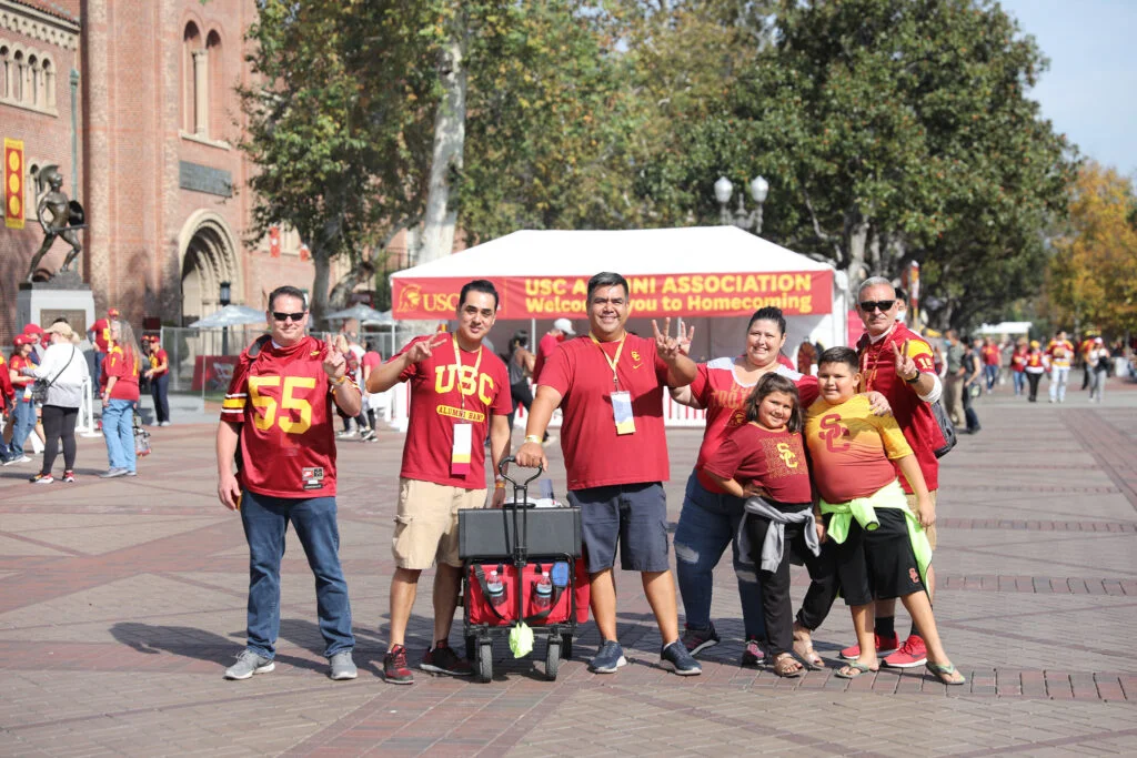 groups of alumni pose on campus