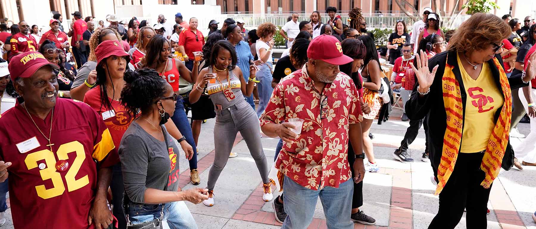 several Black alumni join in during a dance at an event