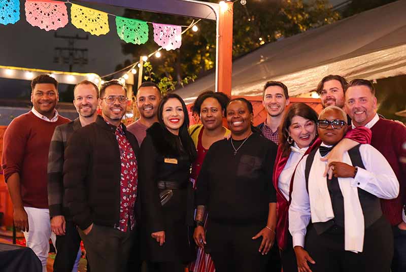 group poses for a photo at the 2022 Lambda Holiday Party