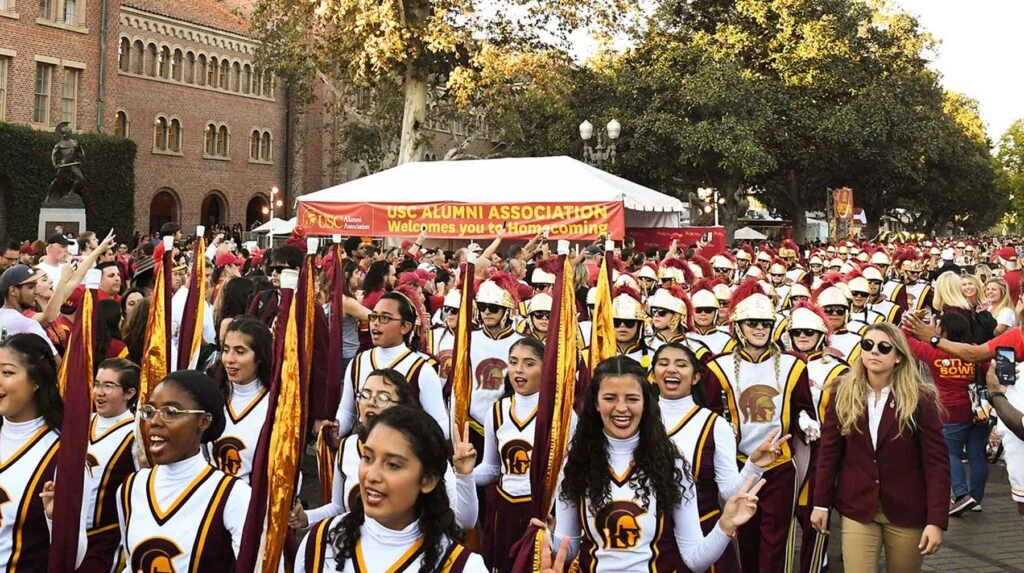 USC spirit leaders march through campus during Homecoming